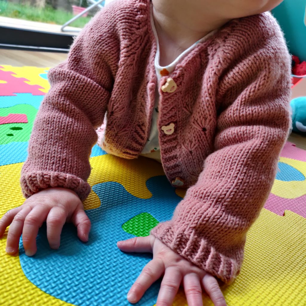 cardigan little dandelion face